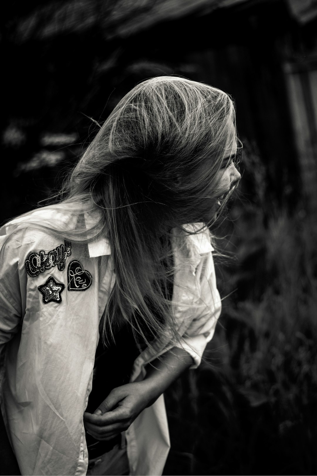 greyscale photo of smiling woman wearing dress shirt