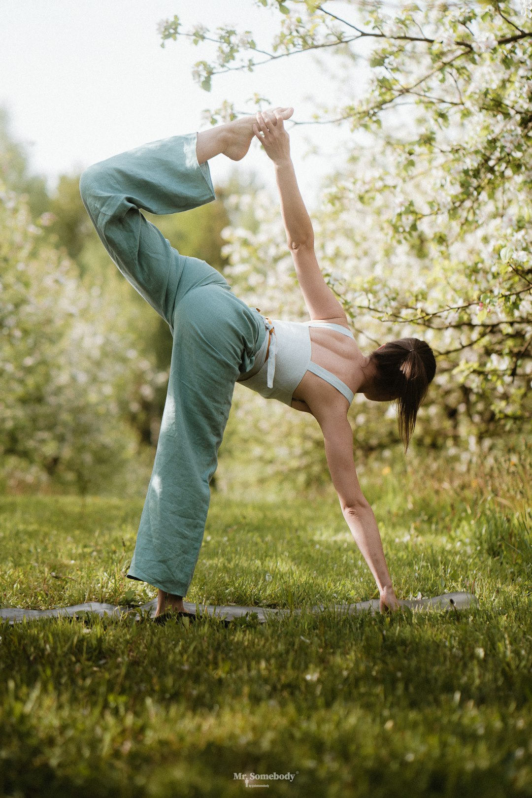 a person doing yoga outside