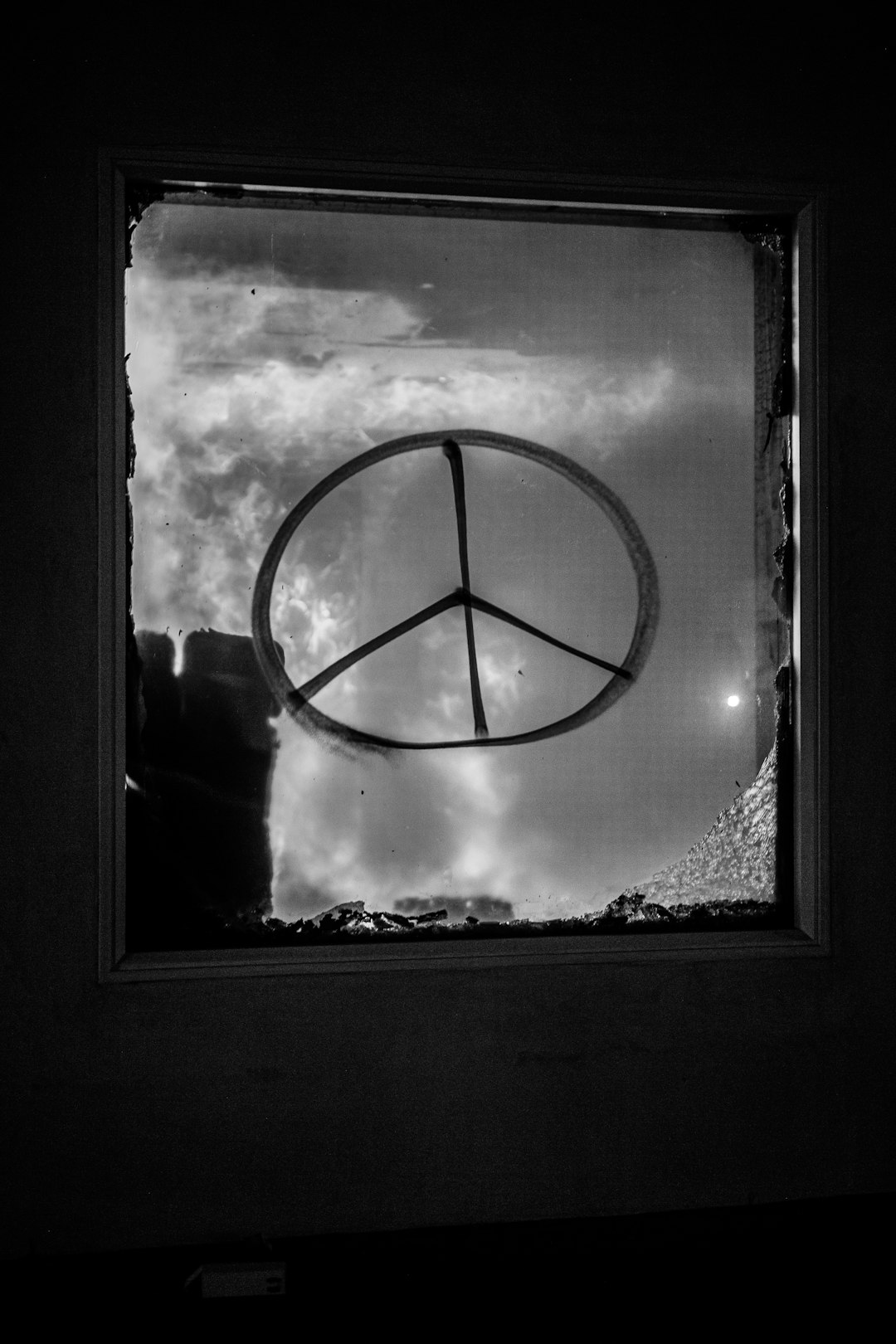 grayscale photo of round mirror