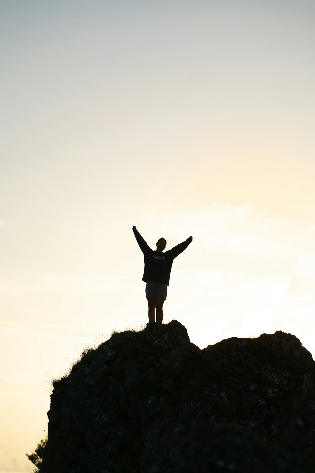 a person standing on a rock