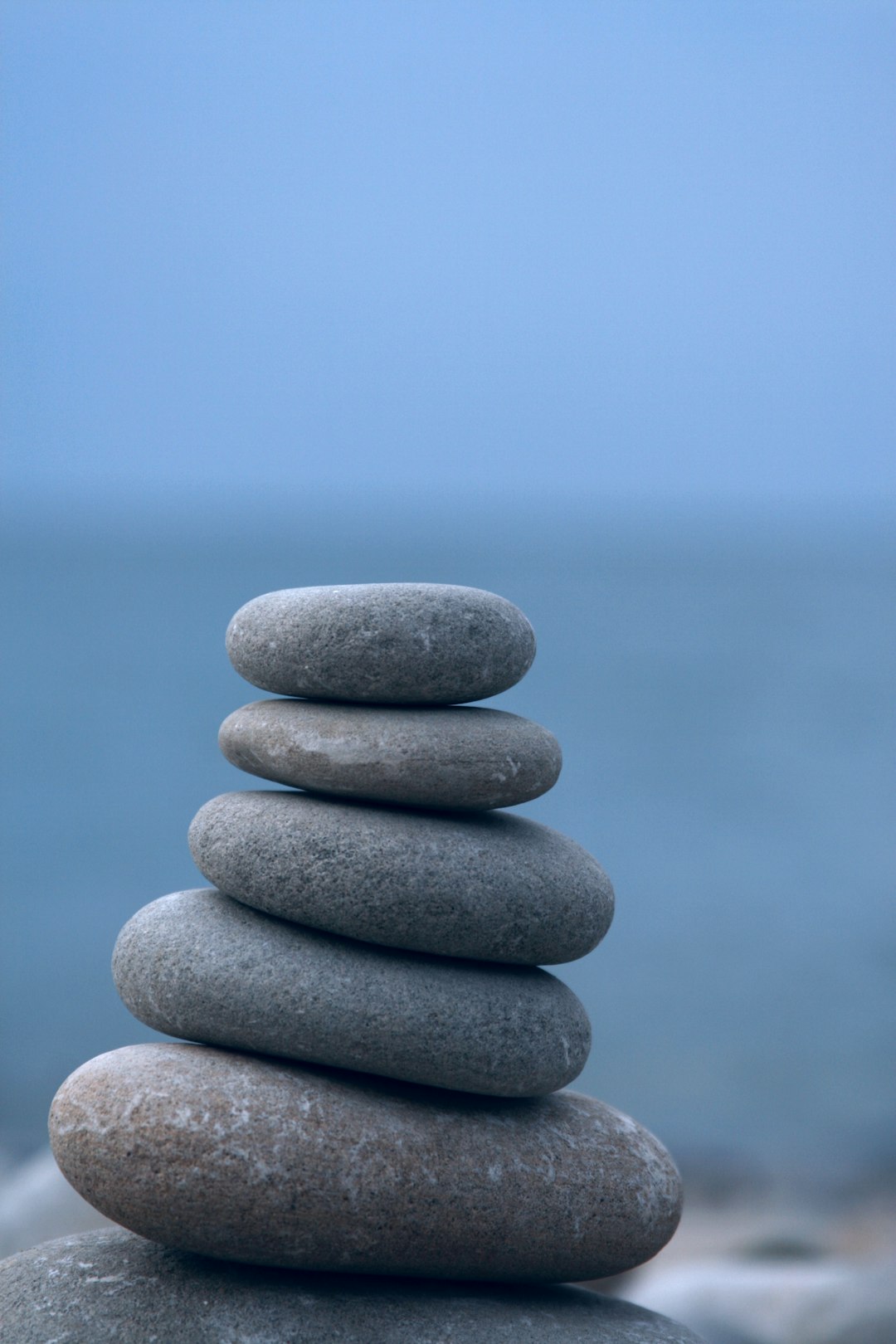 A stack of rocks sitting on top of a beach